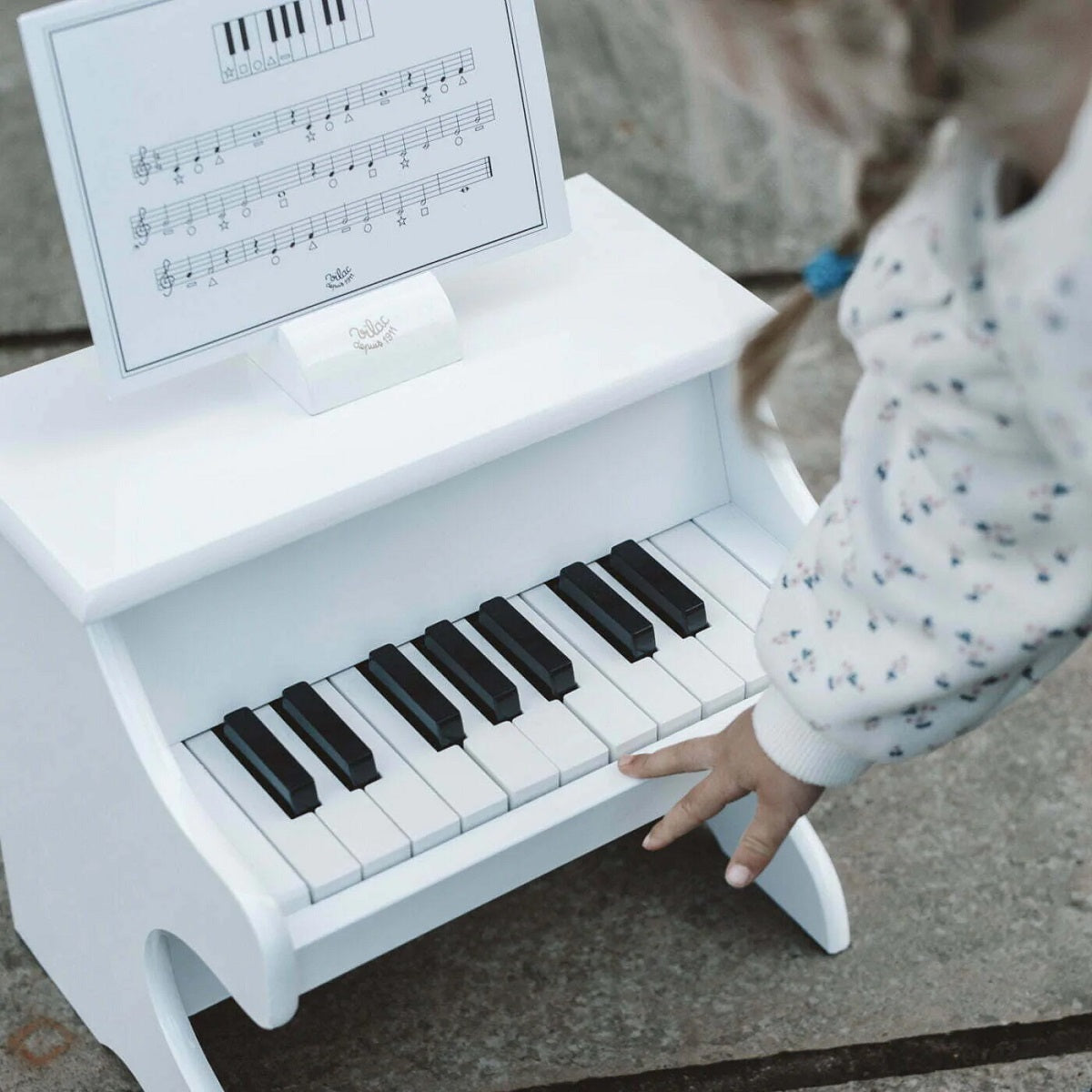 White Wooden Piano with Scores