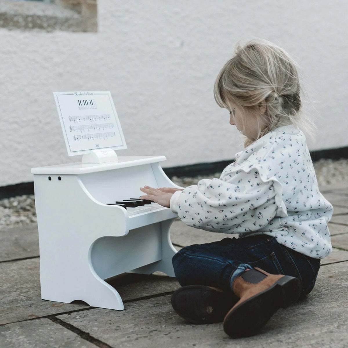 White Wooden Piano with Scores