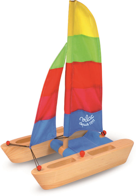 Wooden Catamaran with Brightly Coloured Sail
